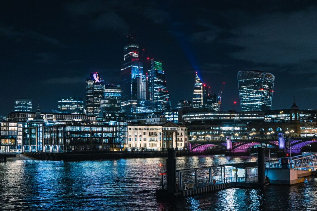 UK city skyline at night showing investment property opportunities in major UK cities including Manchester, Liverpool, Birmingham and Leeds